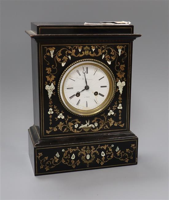 A 19th century French brass inlaid ebonised mantel clock